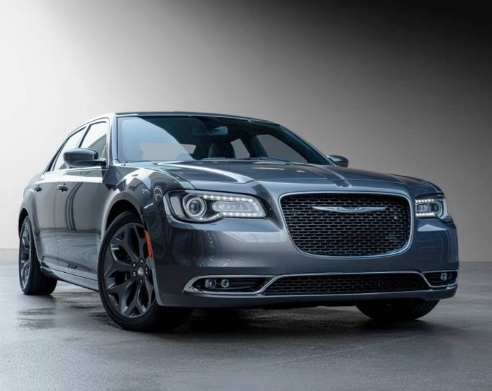 2026 Chrysler 300 silver sitting inside a body shop Precision First Red-Infiniti-sitting-in-the-grass-with-trees-around-it-after-Infiniti-Certified-Collision-Repair.