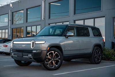 Rivian suv in front of auto body shop-Collision repair Beaverton Precision body & paint
